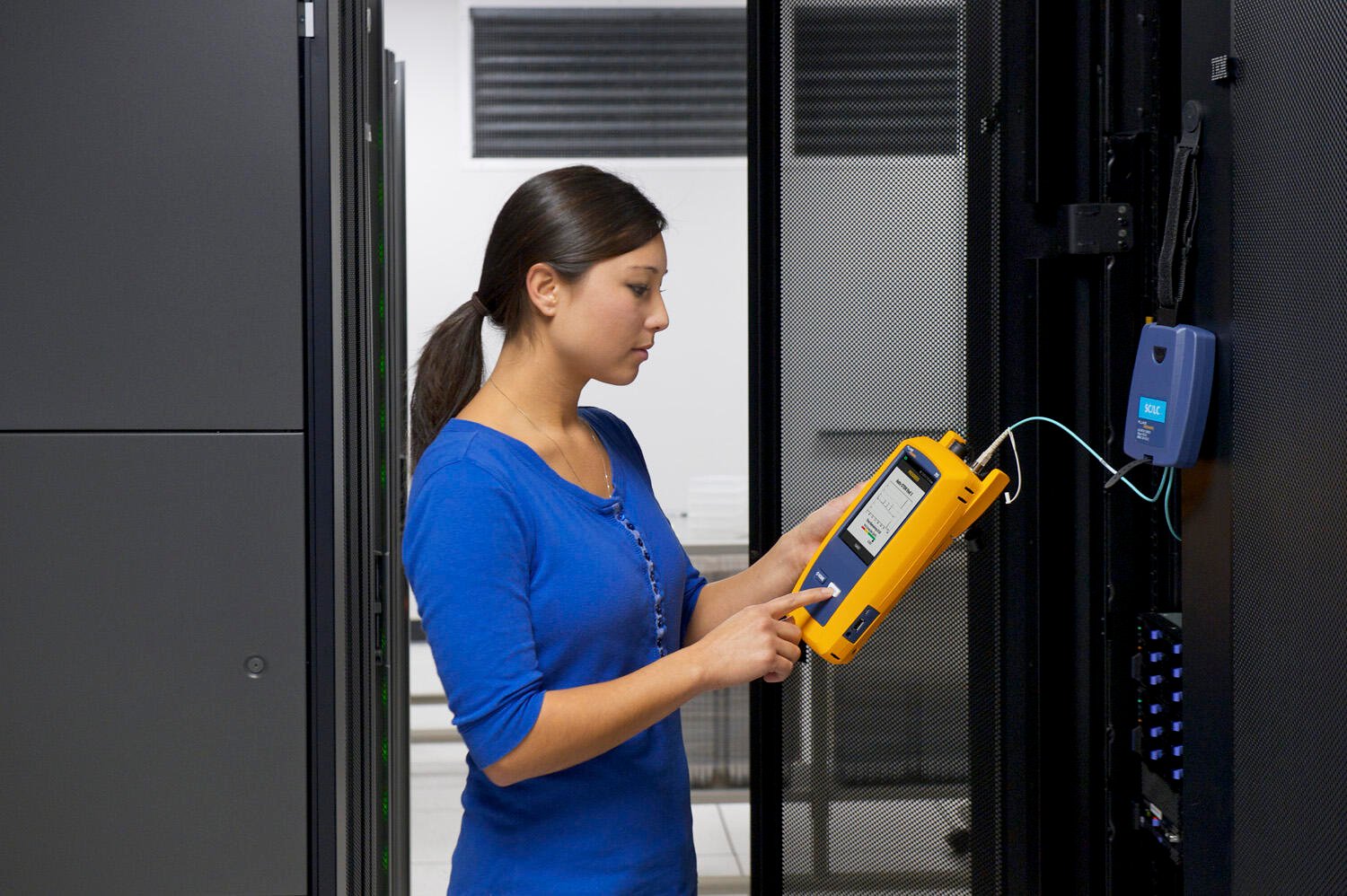 Woman using a Fluke Cable Tester